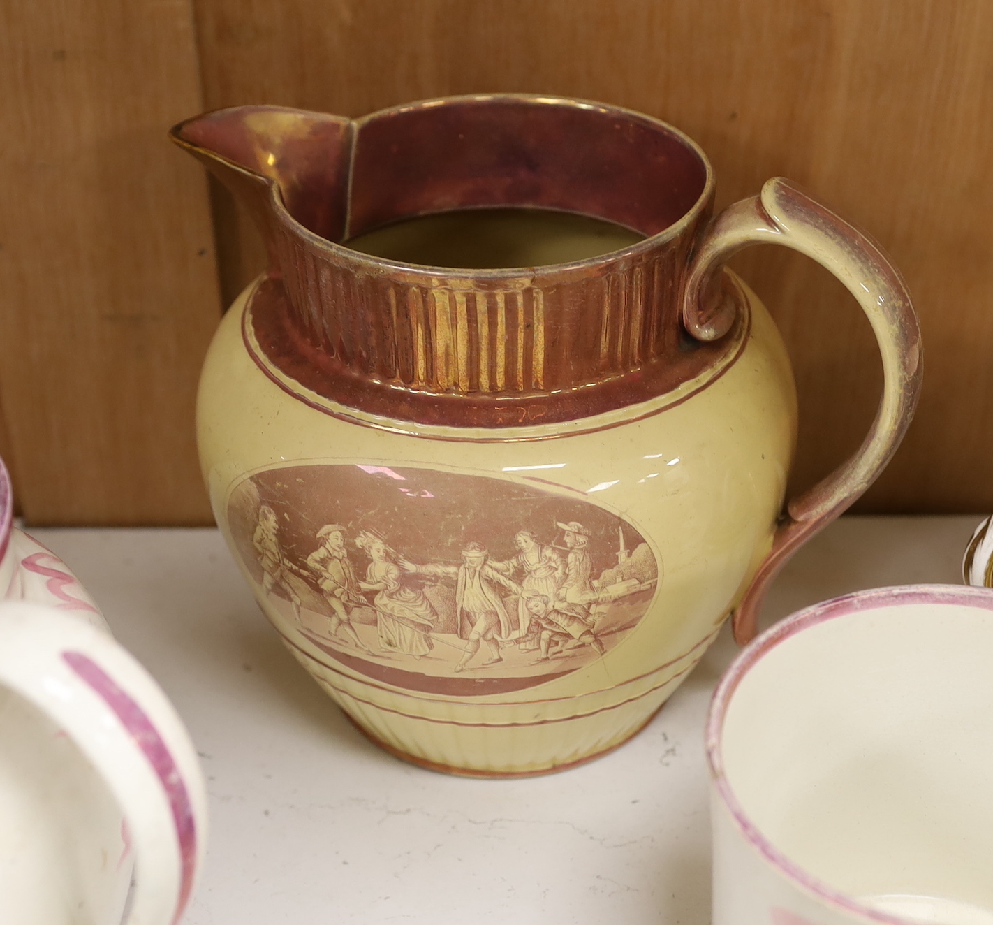 A group of 19th century Staffordshire christening mugs and pink lustre wares